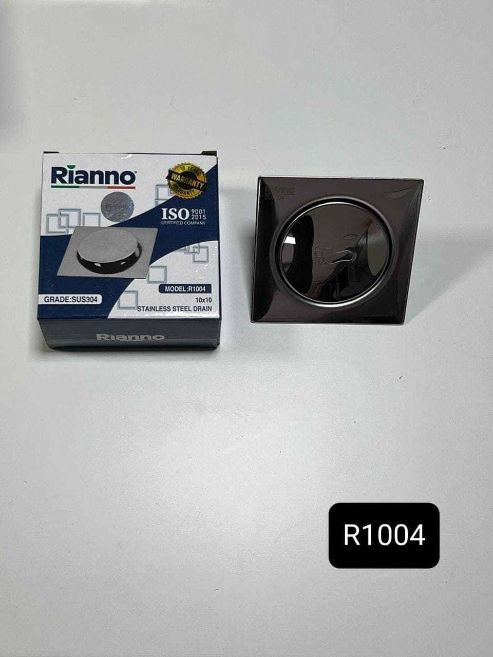 Siphon de Sol Carré à Poussoir Gunmetal Rianno – R1004 – Grade SUS304 (10x10 cm)